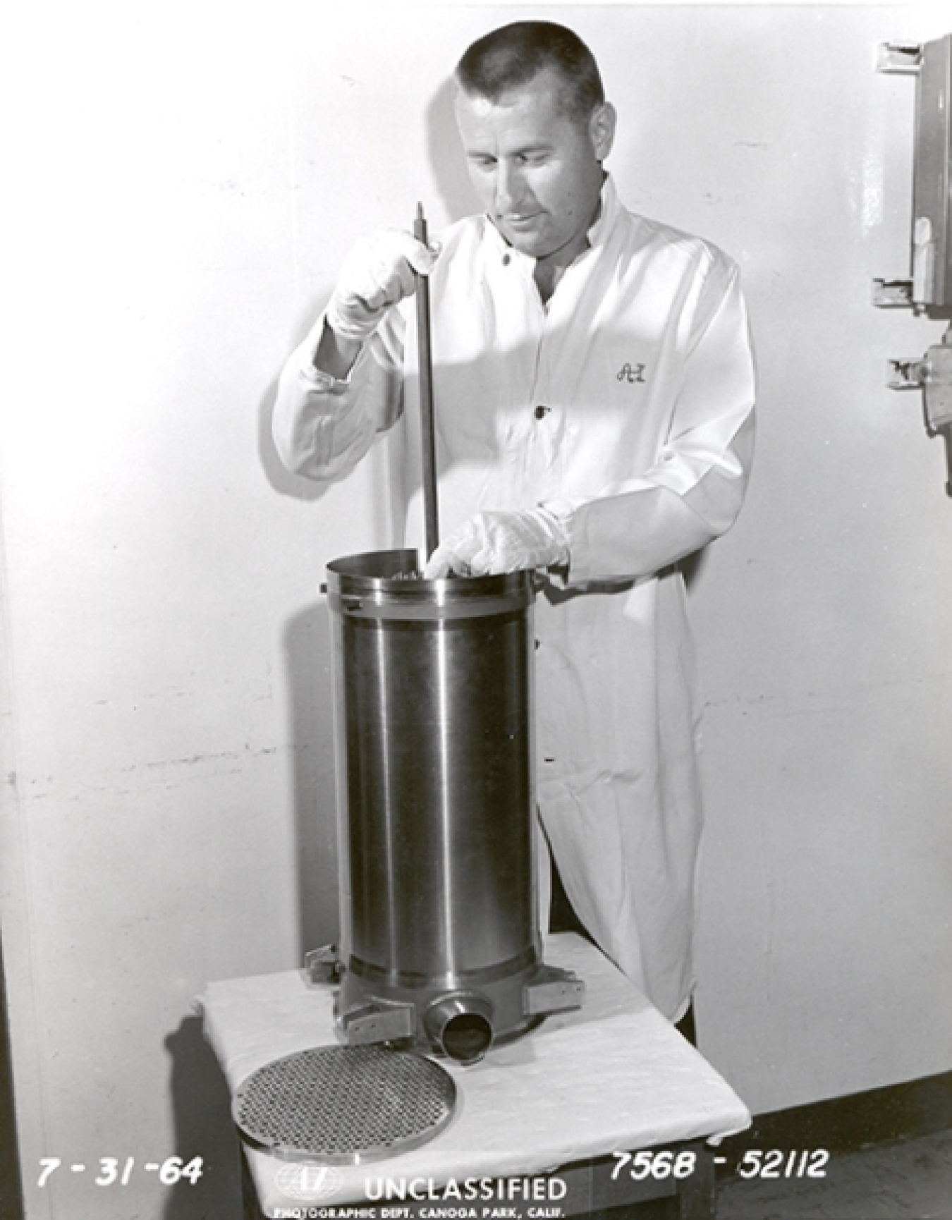 SNAP 8DR reactor assembly. This picture demonstrates how small these reactors were. A steel tube containing fuel is being inserted into the core vessel.