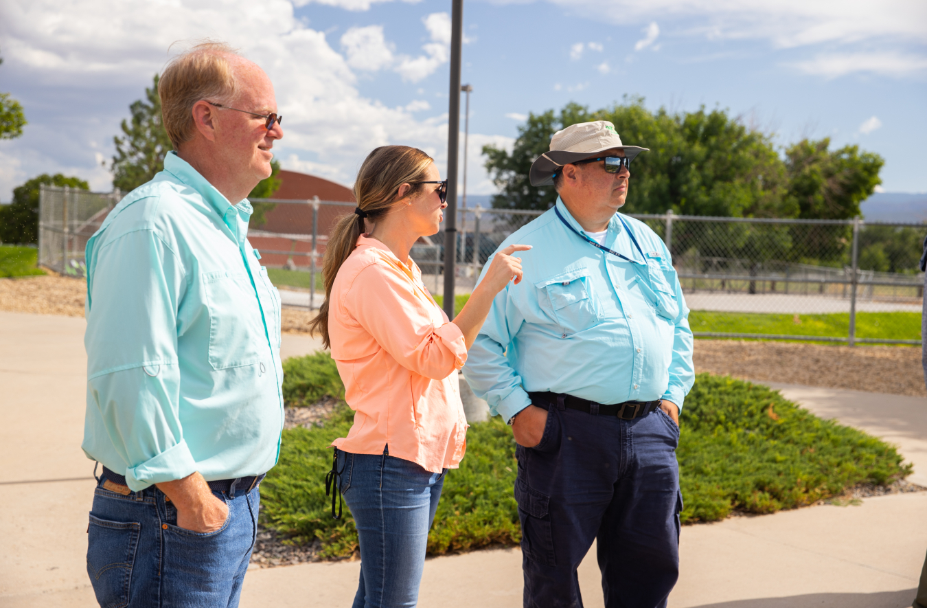 Glascock joins LM Site Manager Sara Woods and LM Director Carmelo Melendez at Las Colonias Park .