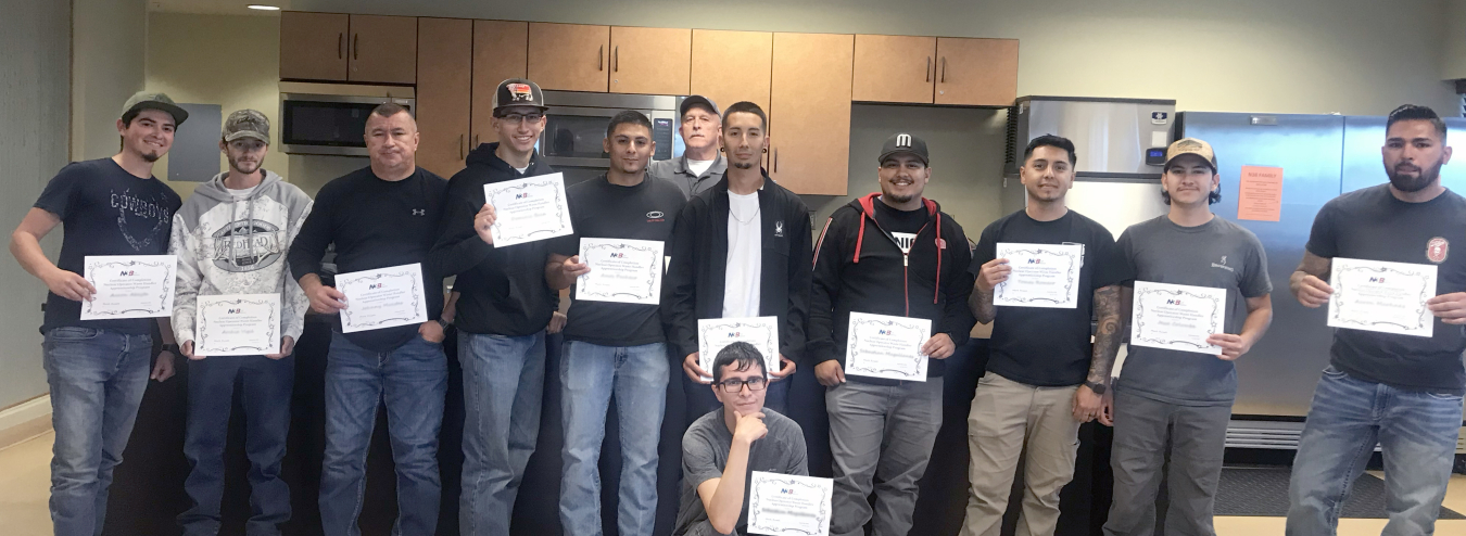 Group of students holding certificates