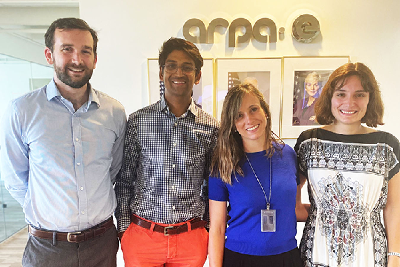 Four young people standing side by side