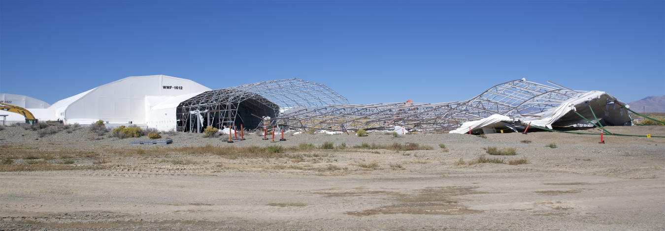 Dome-like white building being dismantled