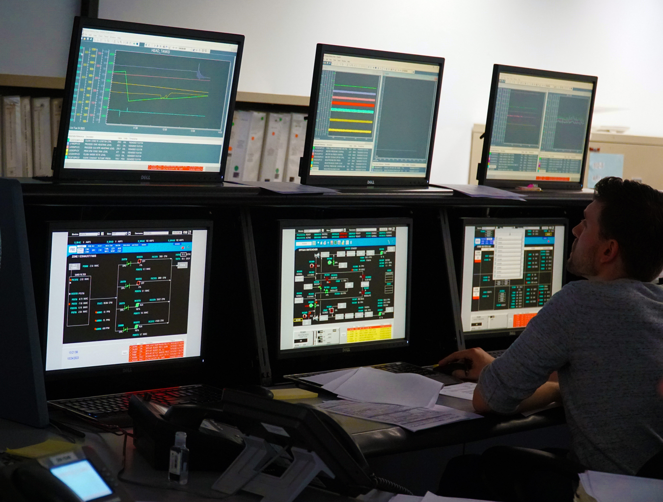 6 computer screens displayed as a part of a control room setup