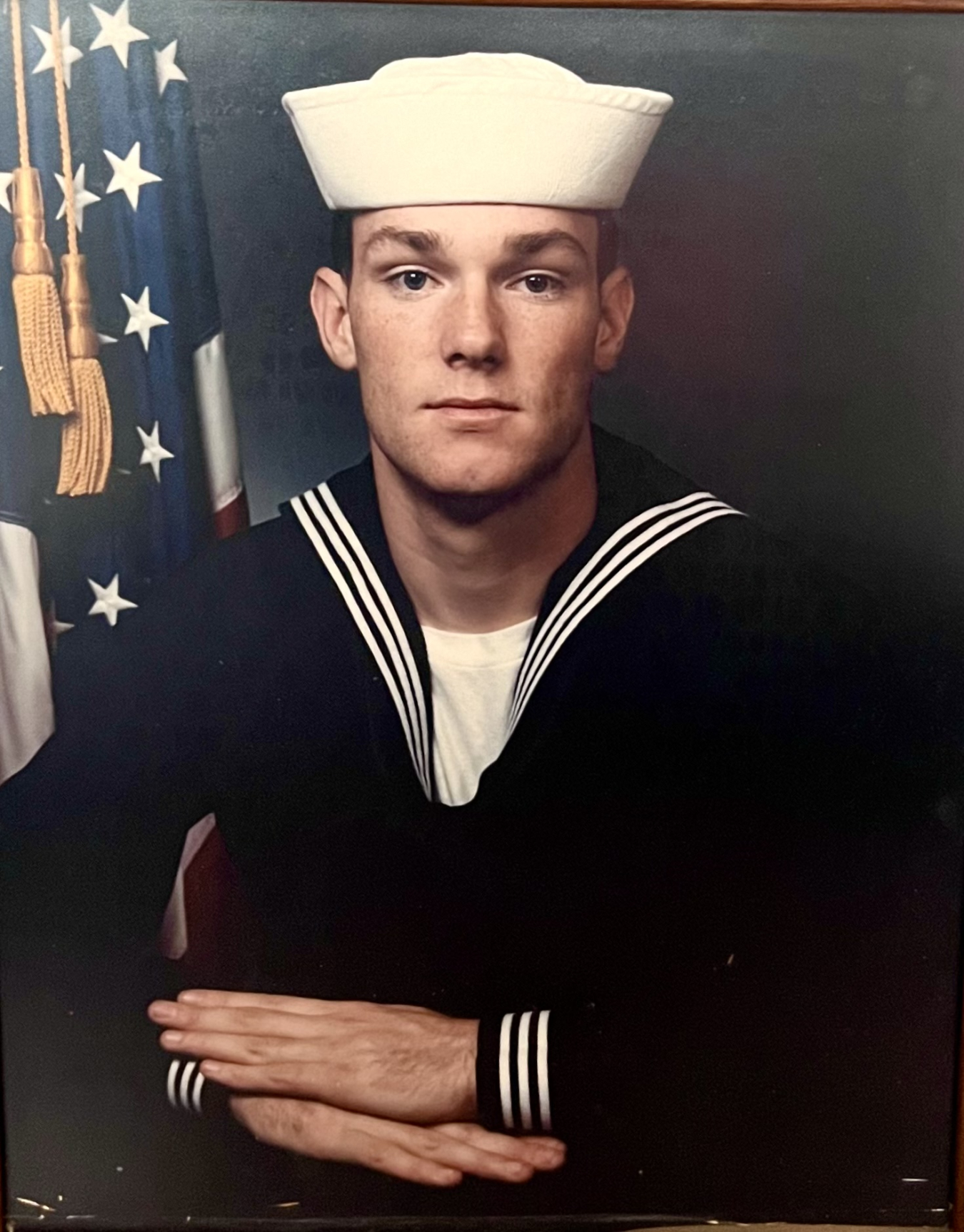 A man in a Navy uniform