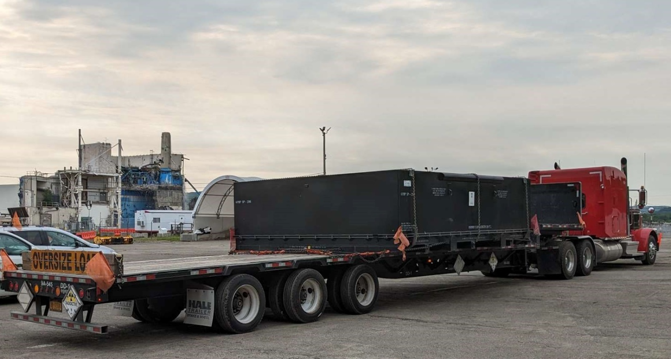 A tractor trailer truck hauling containers