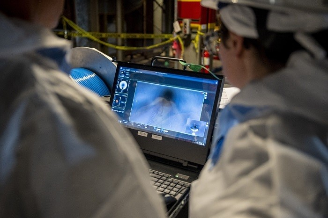 project team inspects piping using the robotic pipe crawler