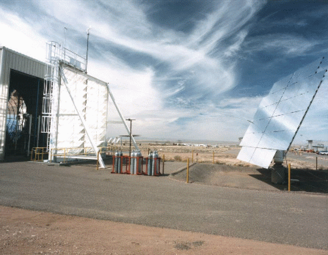 Solar furnace with heliostat, control louvers, and heliostat.