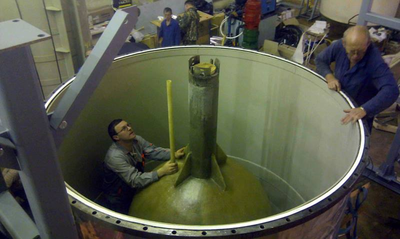 The BEST apparatus under construction. This image shows the inner tank, with a BEST researcher standing in the outer tank.