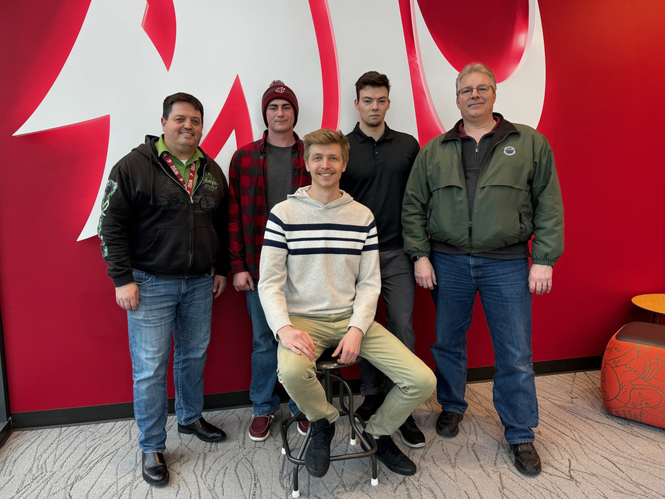 A group of college students pose for a picture