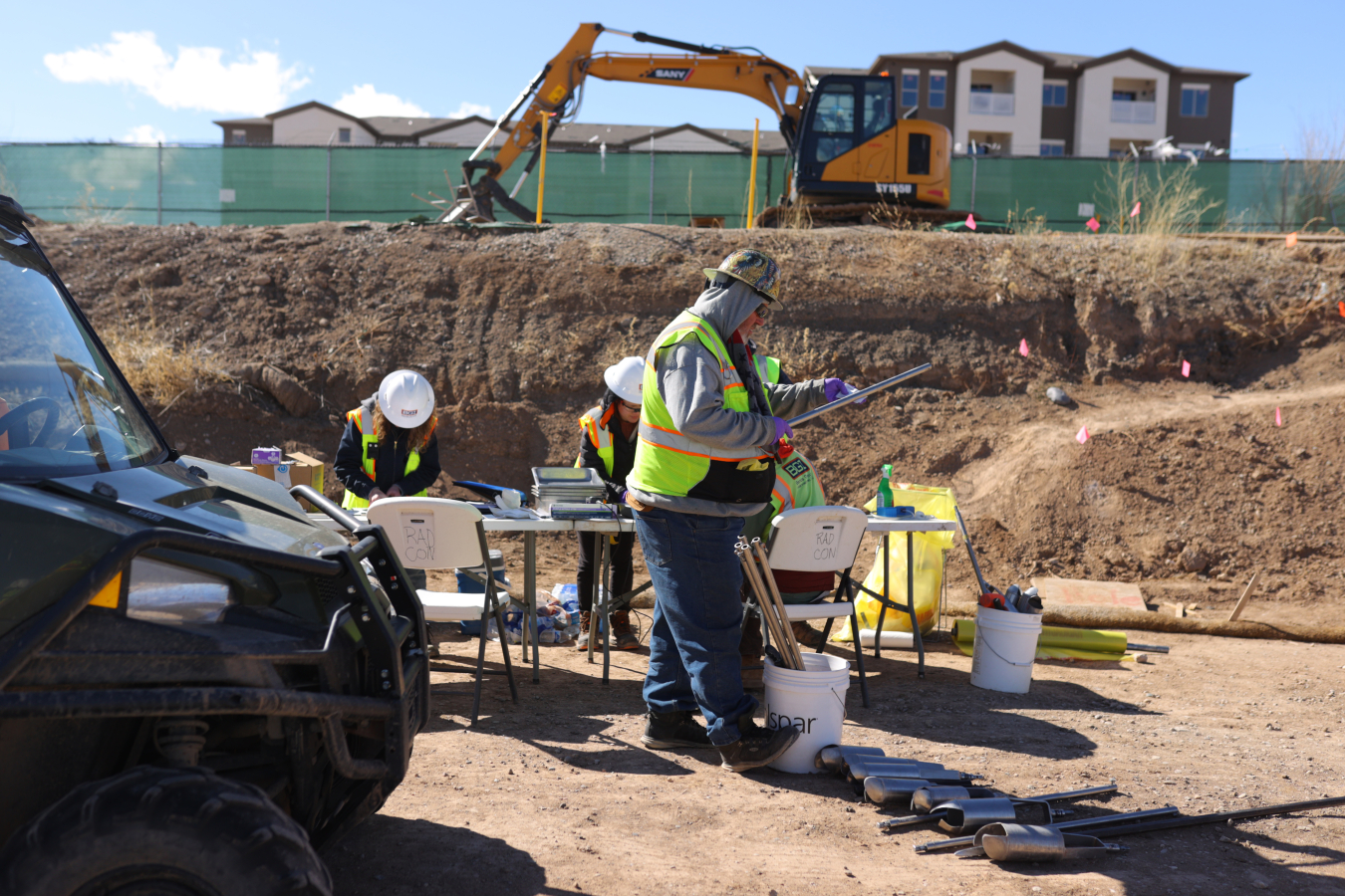 Employees taking samples at a work site