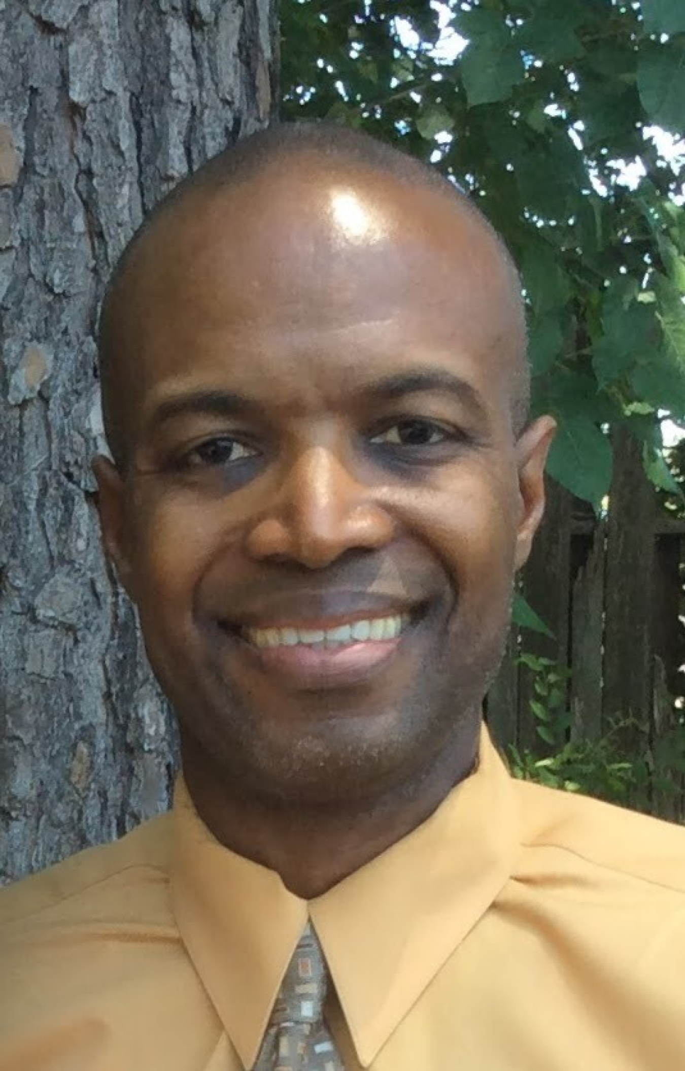 A headshot of Comas Haynes