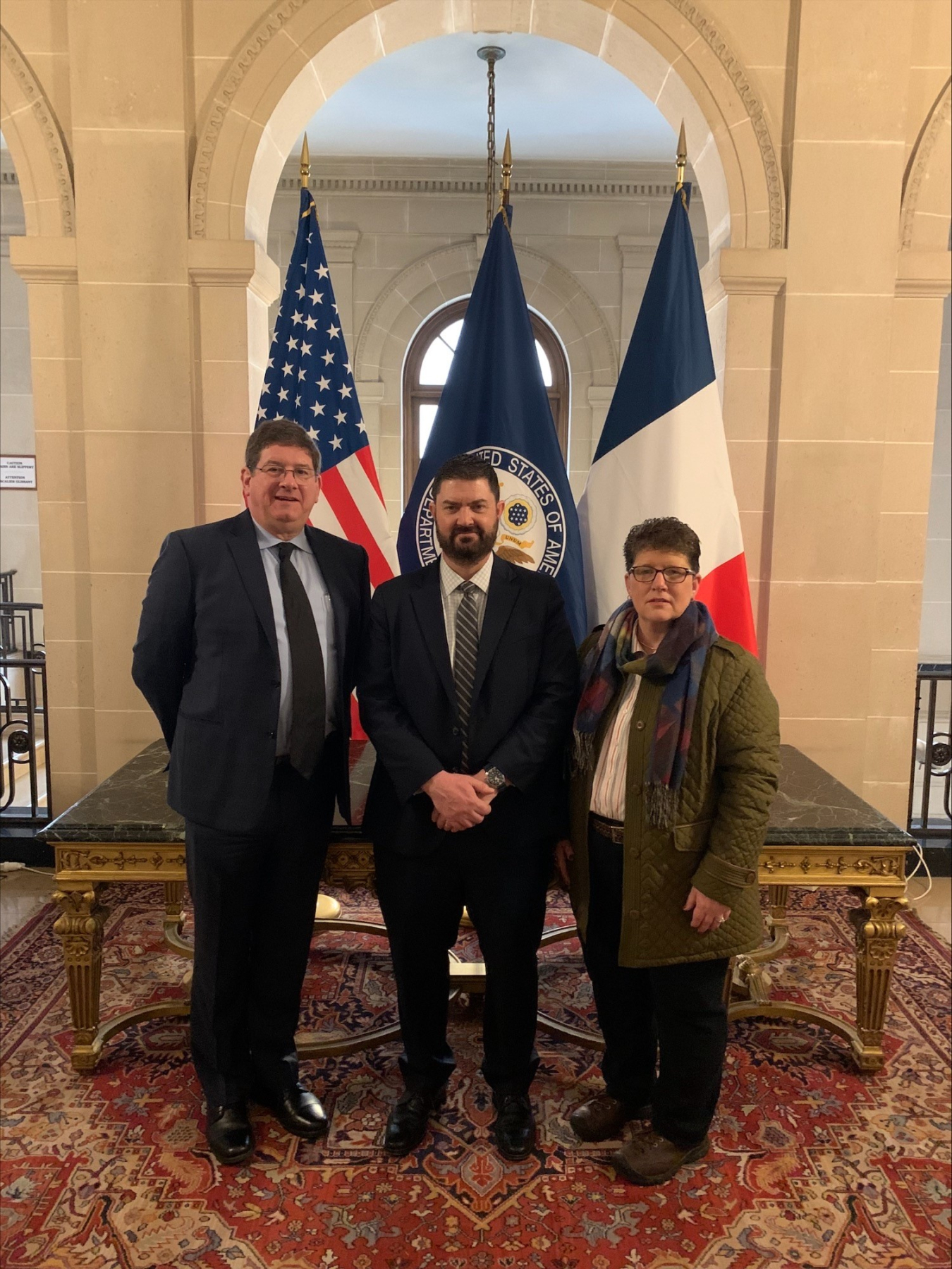 Three EM leaders pose for a picture inside a French Embassy