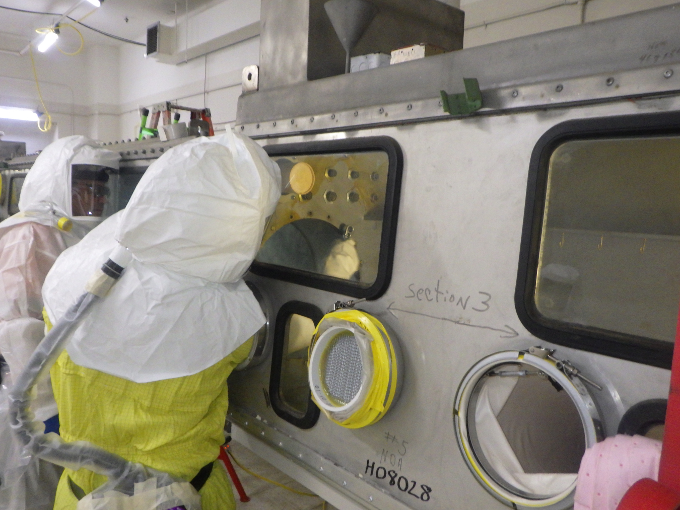 EM workers removing a glove box