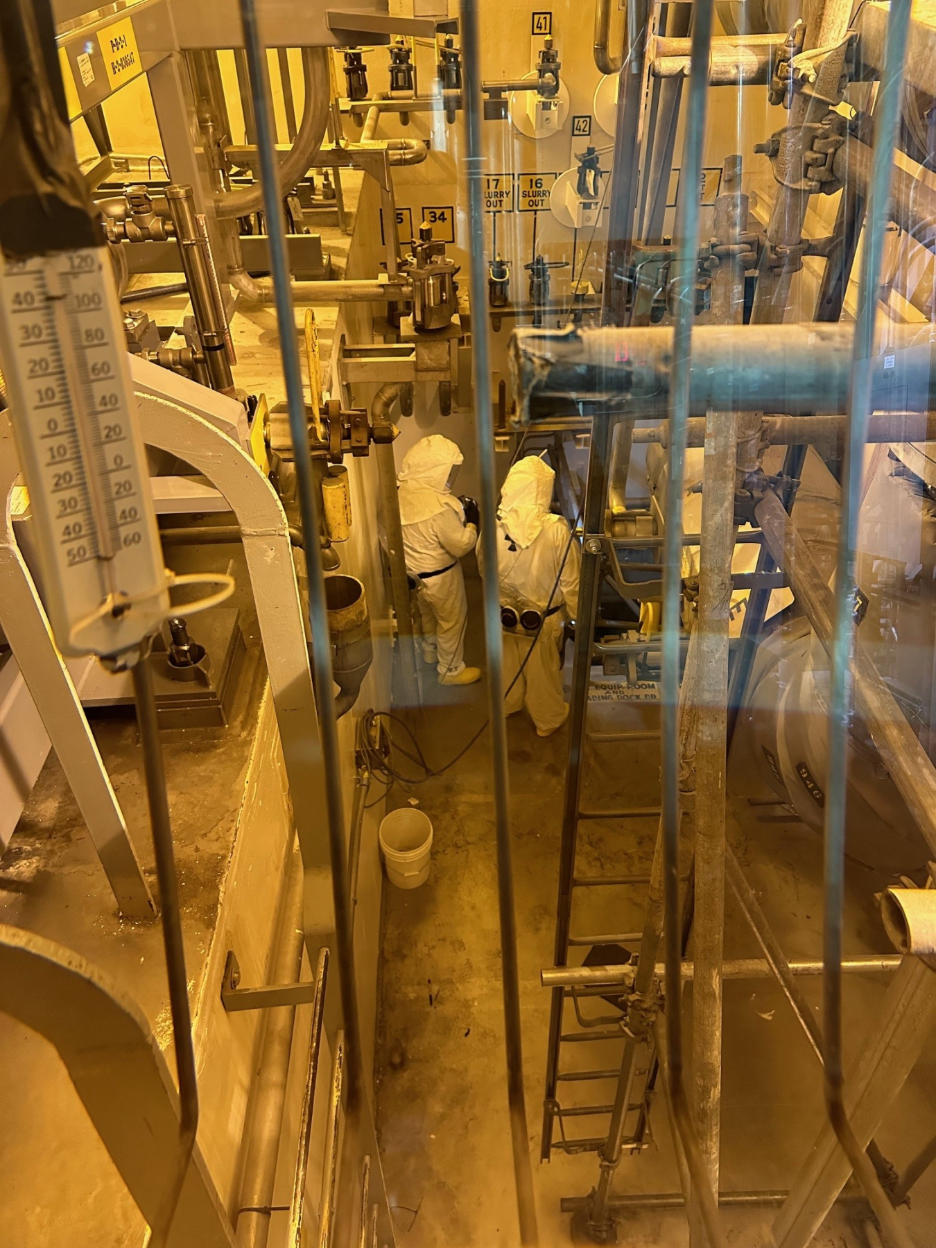 A large room with lots of pipes and machines