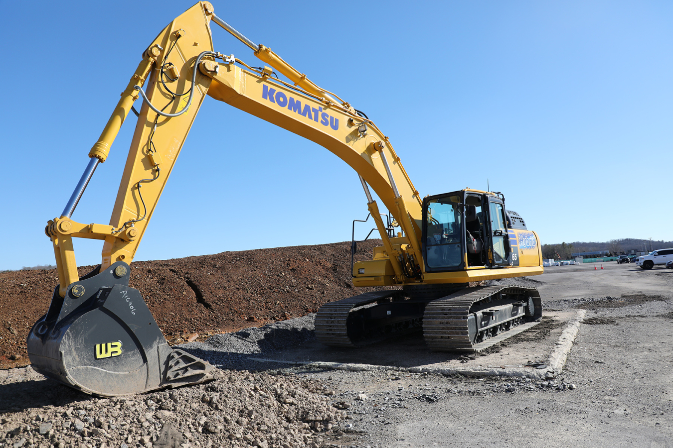A large yellow hybrid excavator 