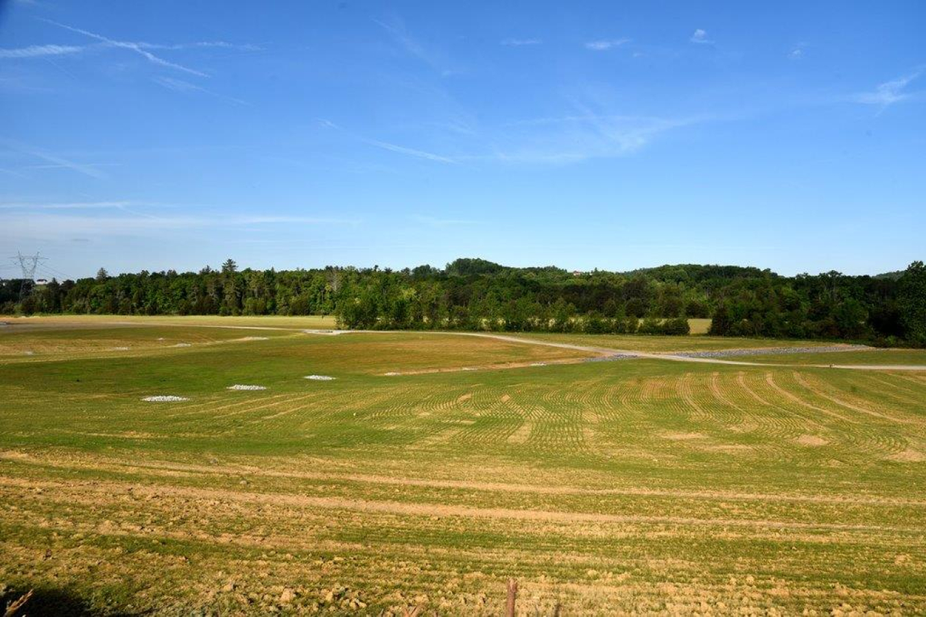 A large, open field where the Oak Ridge Powerhouse Complex used to stand
