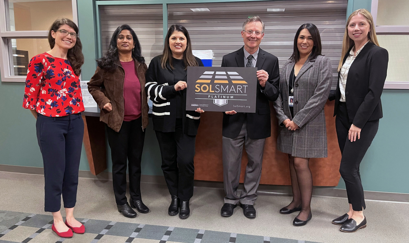 Fremont, California government leaders accept first-ever SolSmart Platinum designation in the lobby of a building.