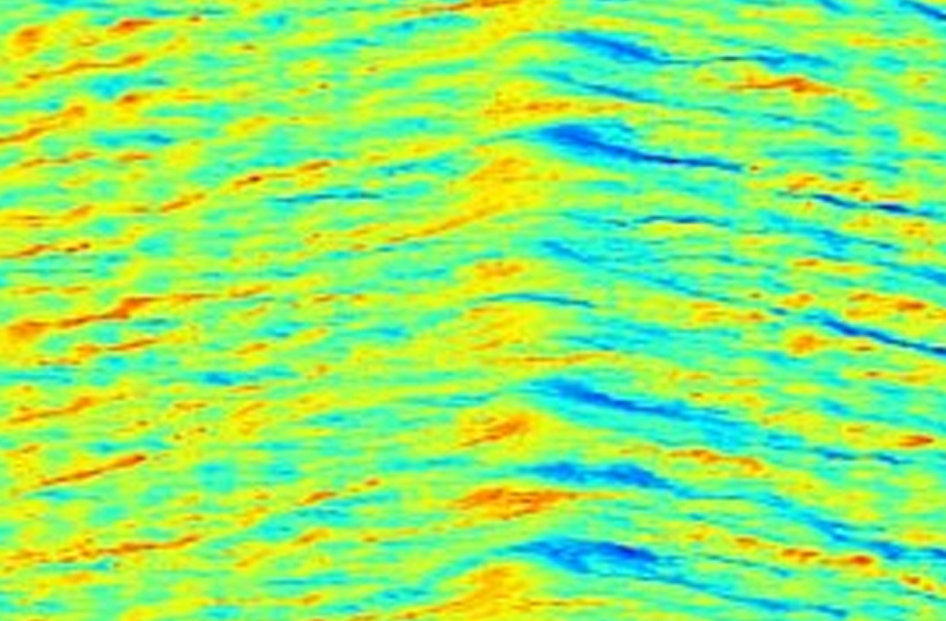 A heat-map style image that looks like a mountain range with reds at the top of the peaks in the middle and greens and blues down the sides.
