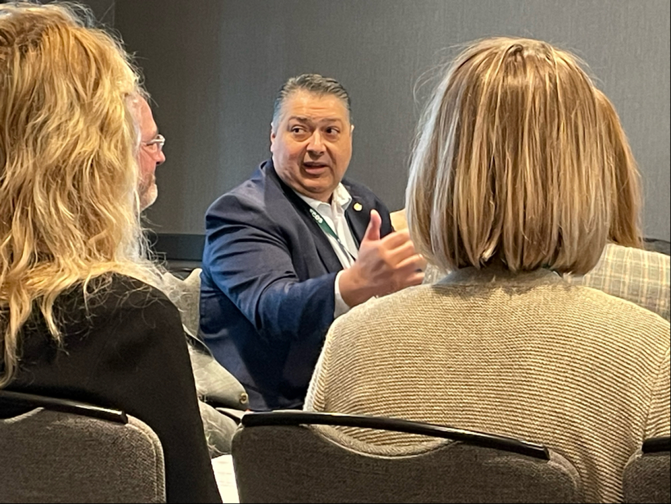 LM Director Carmelo Melendez visits with attendees Tuesday morning.