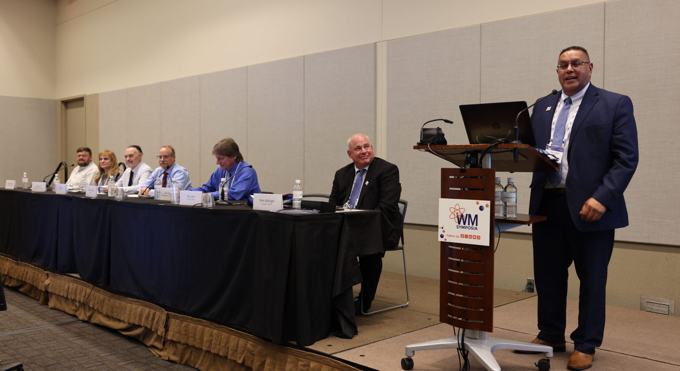 Panelists and speakers on a stage