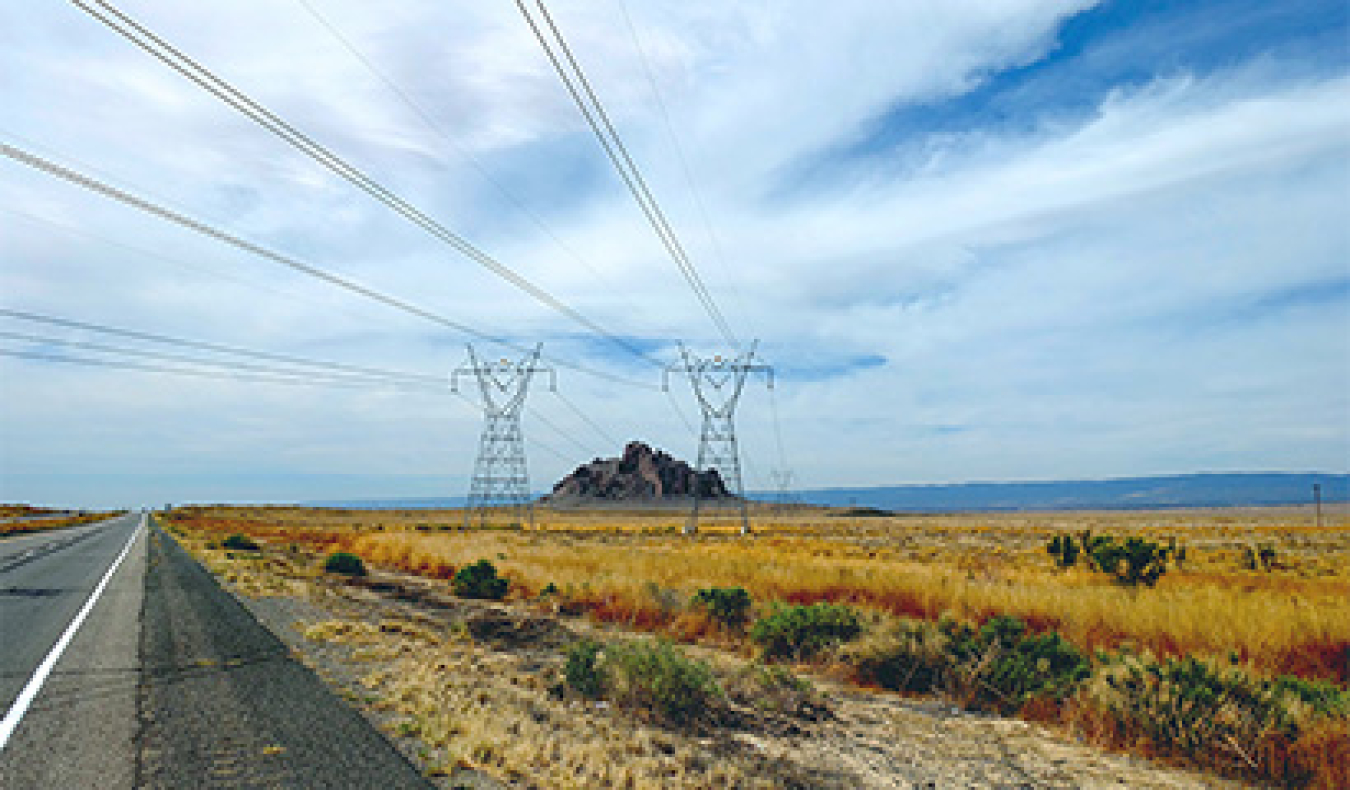A scenic view of high transmission towers in a remote area of the US