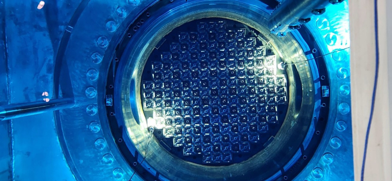 Photo inside Vogtle Unit 3 reactor at criticality, emitting a blue glow.