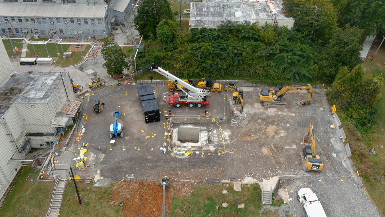 Aerial shot of a cleanup site with lots of construction vehicles around