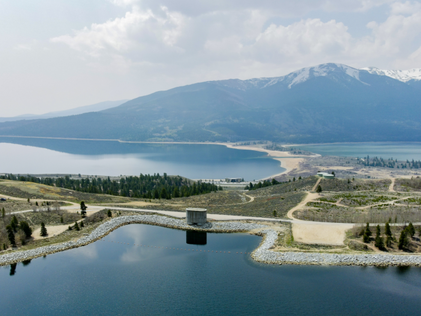 A pumped storage hydropower facility with water held in two reservoirs at different elevations.