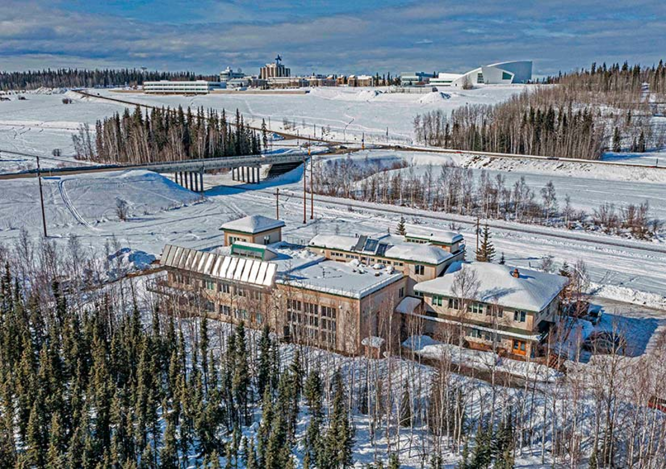 A geothermal heat pump heats the 5,000-square-foot original section of the National Renewable Energy Laboratory’s Alaska Campus, seen in the far right of the photo. 