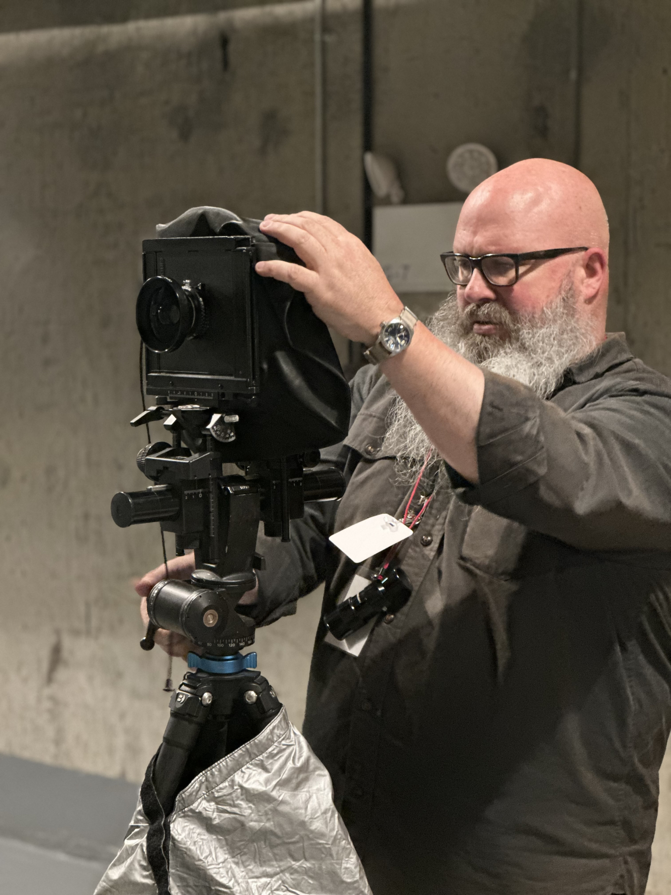A man using a large camera