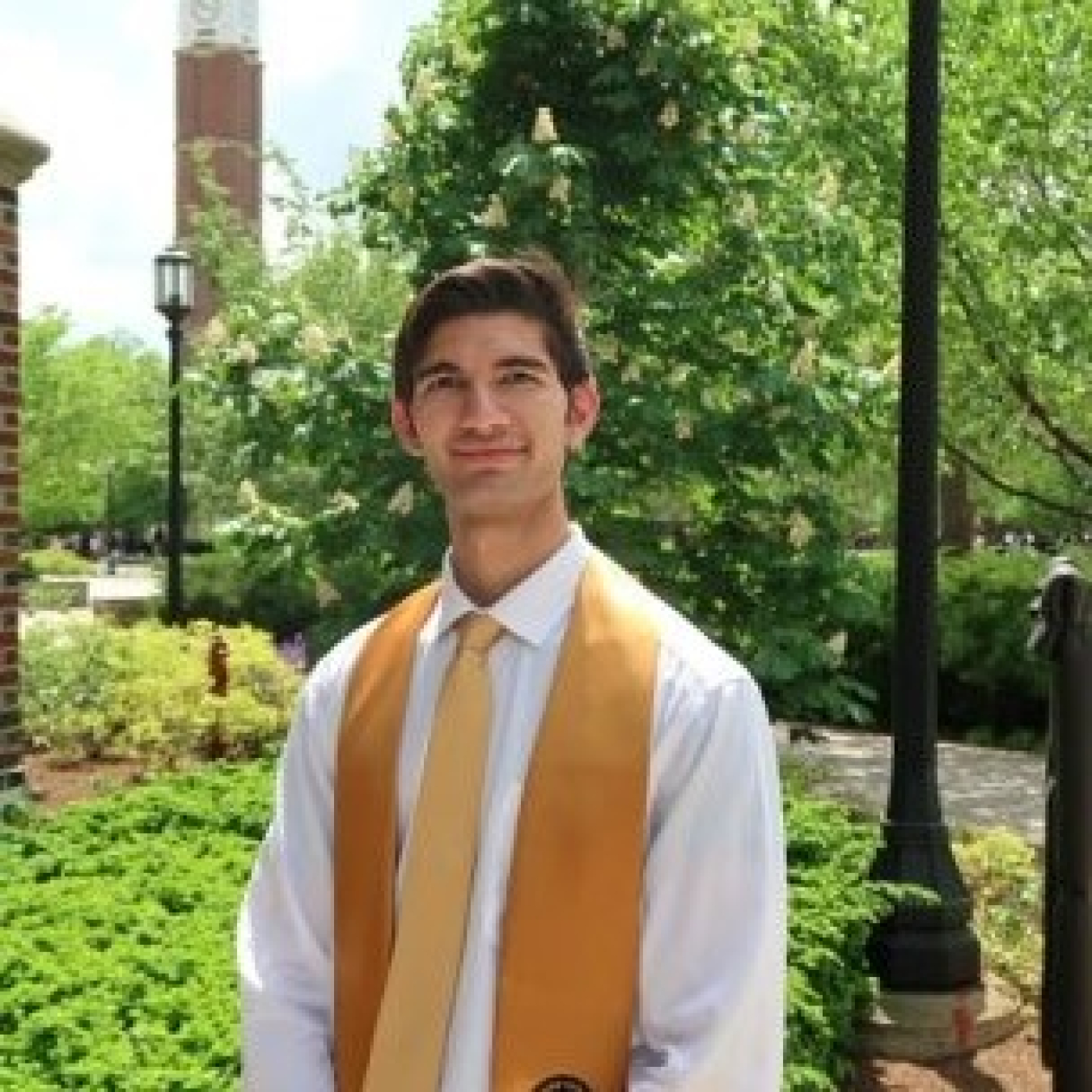 Eric Cobos in a shirt, tie, and vest outside
