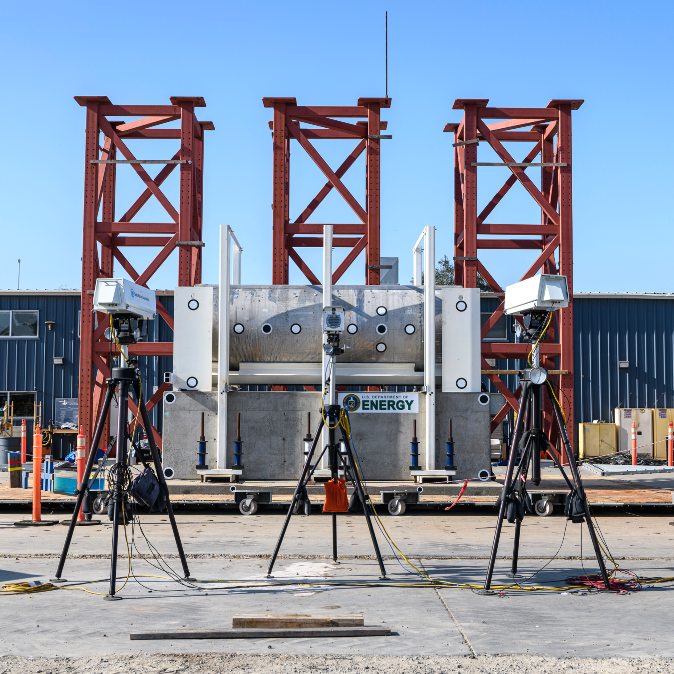 Cameras record the performance of a horizontal spent nuclear fuel cask on the shake table.