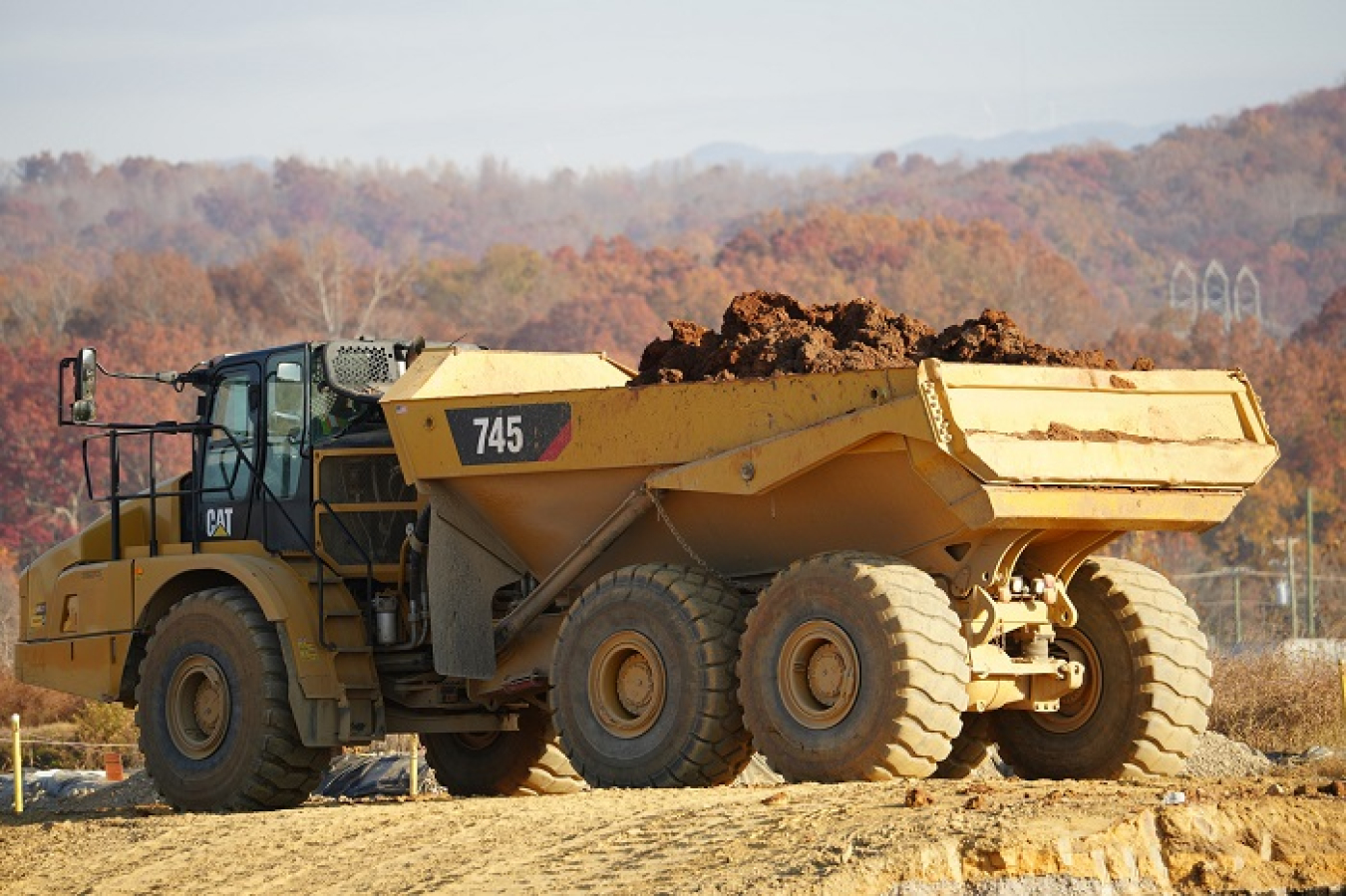 A dump truck carries contaminated soil from the massive former K-25 building at the East Tennessee Technology Park.
