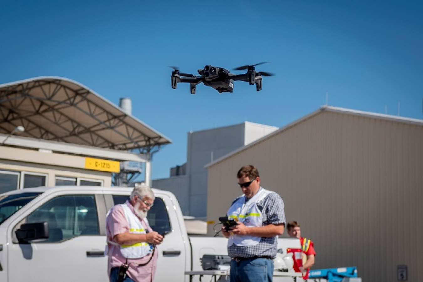 Two people operating a drone.