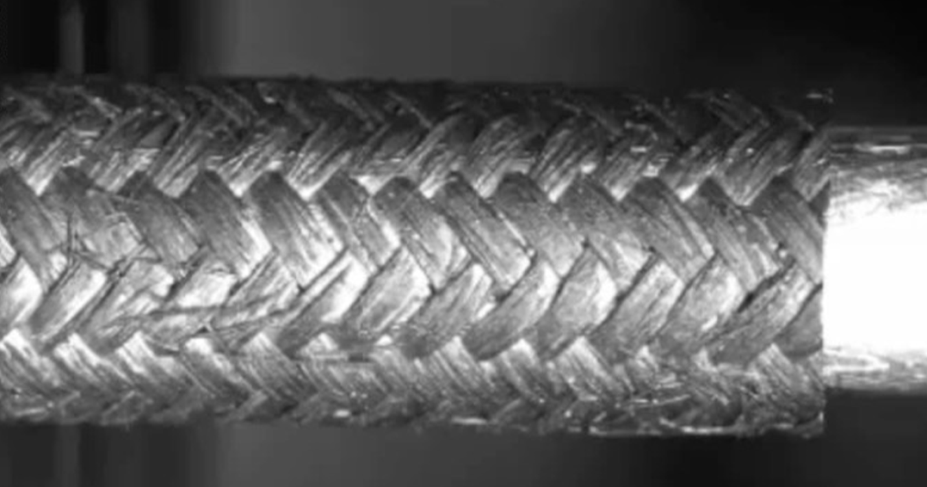Black and white image of a woven silicon carbide tube