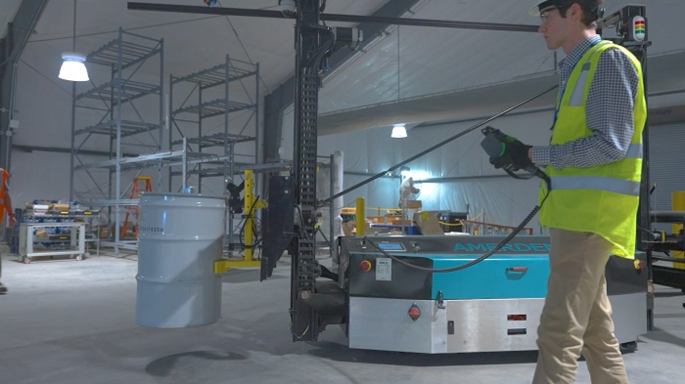 A person operates an automated guided vehicle.