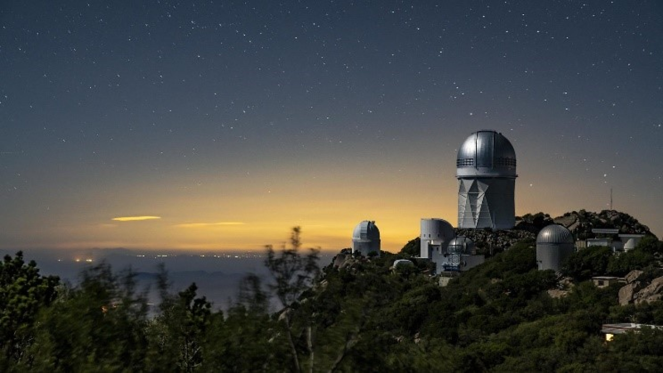 The Dark Energy Spectroscopic Instrument at the Mayall Telescope at Kitt Peak National Observatory will use 5,000 robotic “eyes” to map the history of cosmic expansion.