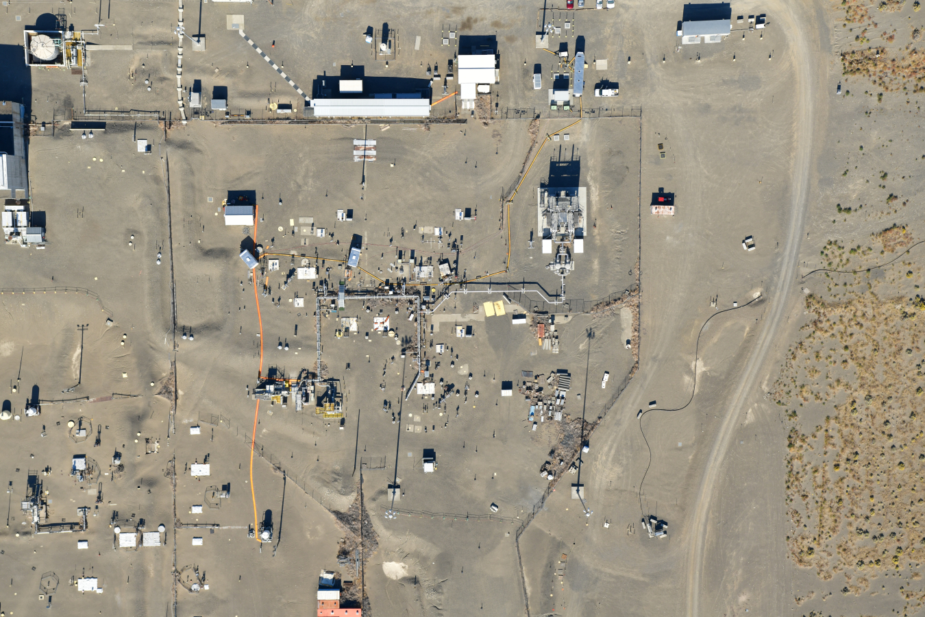 An aerial view of a large work site with lots of open pavement space