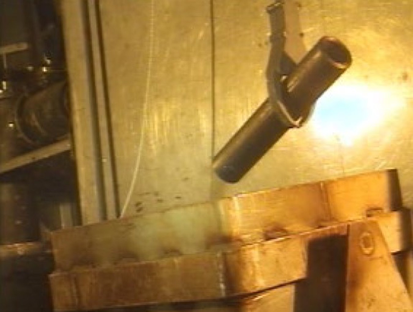 An underground room where a pipe is being lifted up