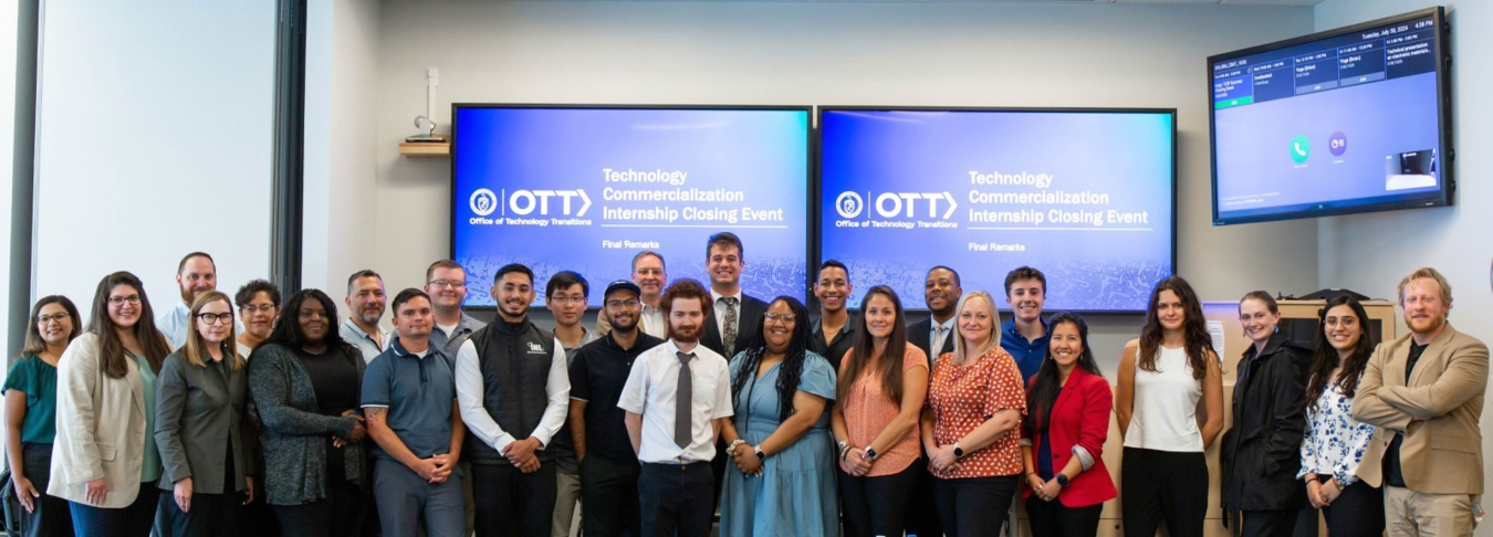 Technology Commercialization Internship graduates and DOE staff at the 2024 closing event at Sandia National Laboratory