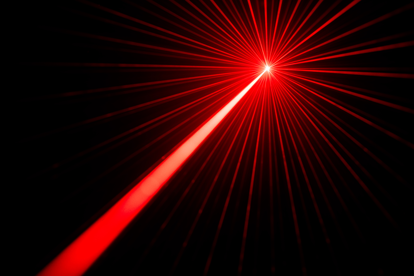 Image of a red laser beam with light refraction