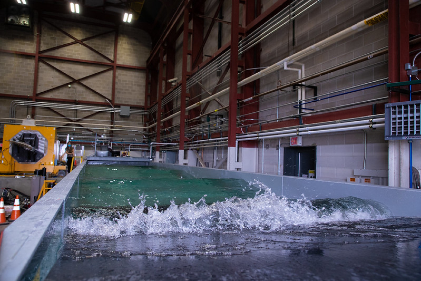 A wave tank at NREL’s Flatiron Campus inside of a stone building.