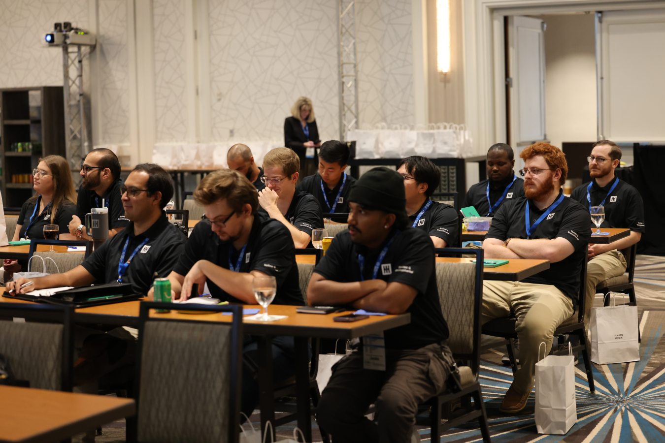 A crowd of young professionals attending a conference
