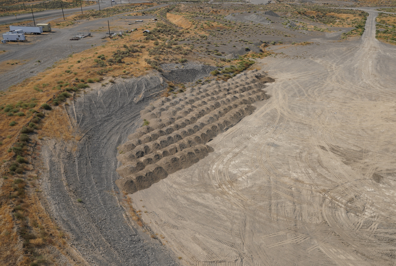 An aerial view of a large gravel and dirt pit
