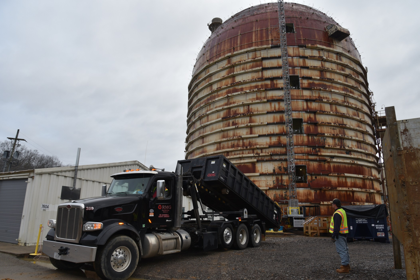 A truck is in front of the Experimental Gas-Cooled Reactor at Oak Ridge National Laboratory.