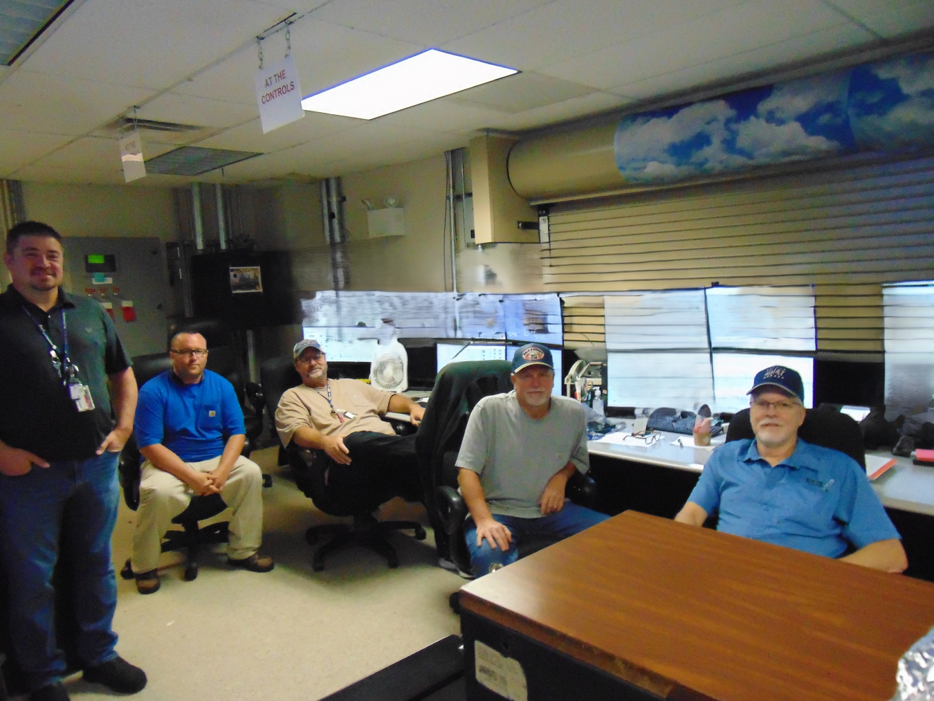 Portsmouth Site Depleted Uranium Hexafluoride Facility team members gather in the control room.