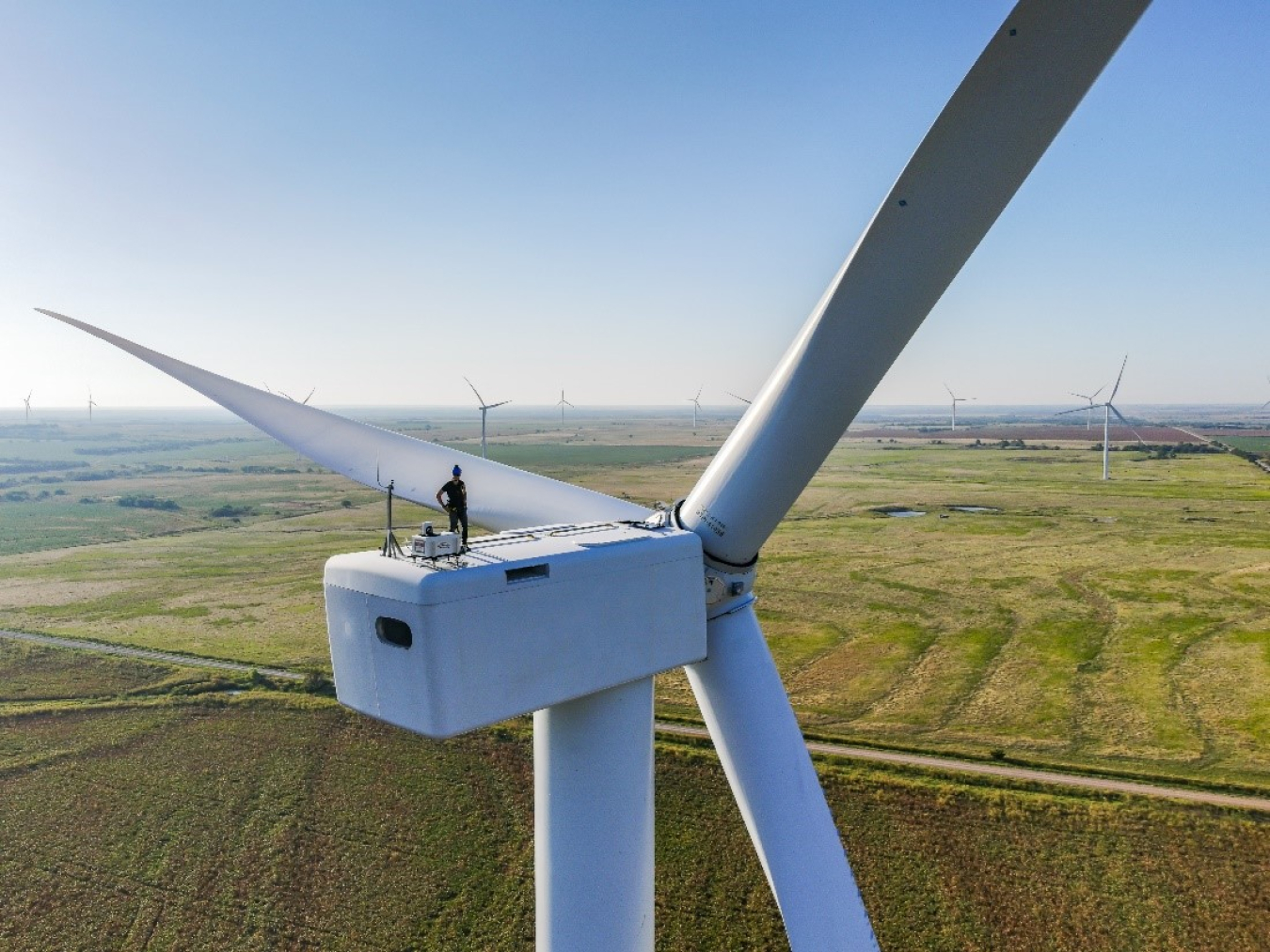 Worker on top of a wind turbine.