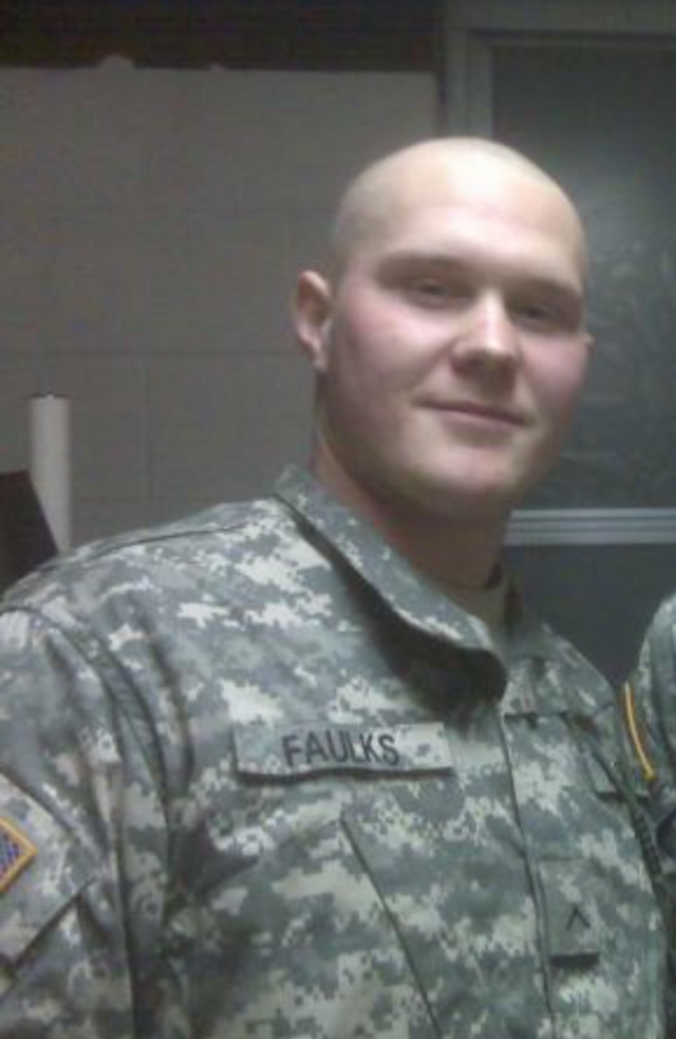 A person in a military uniform looking at the camera.