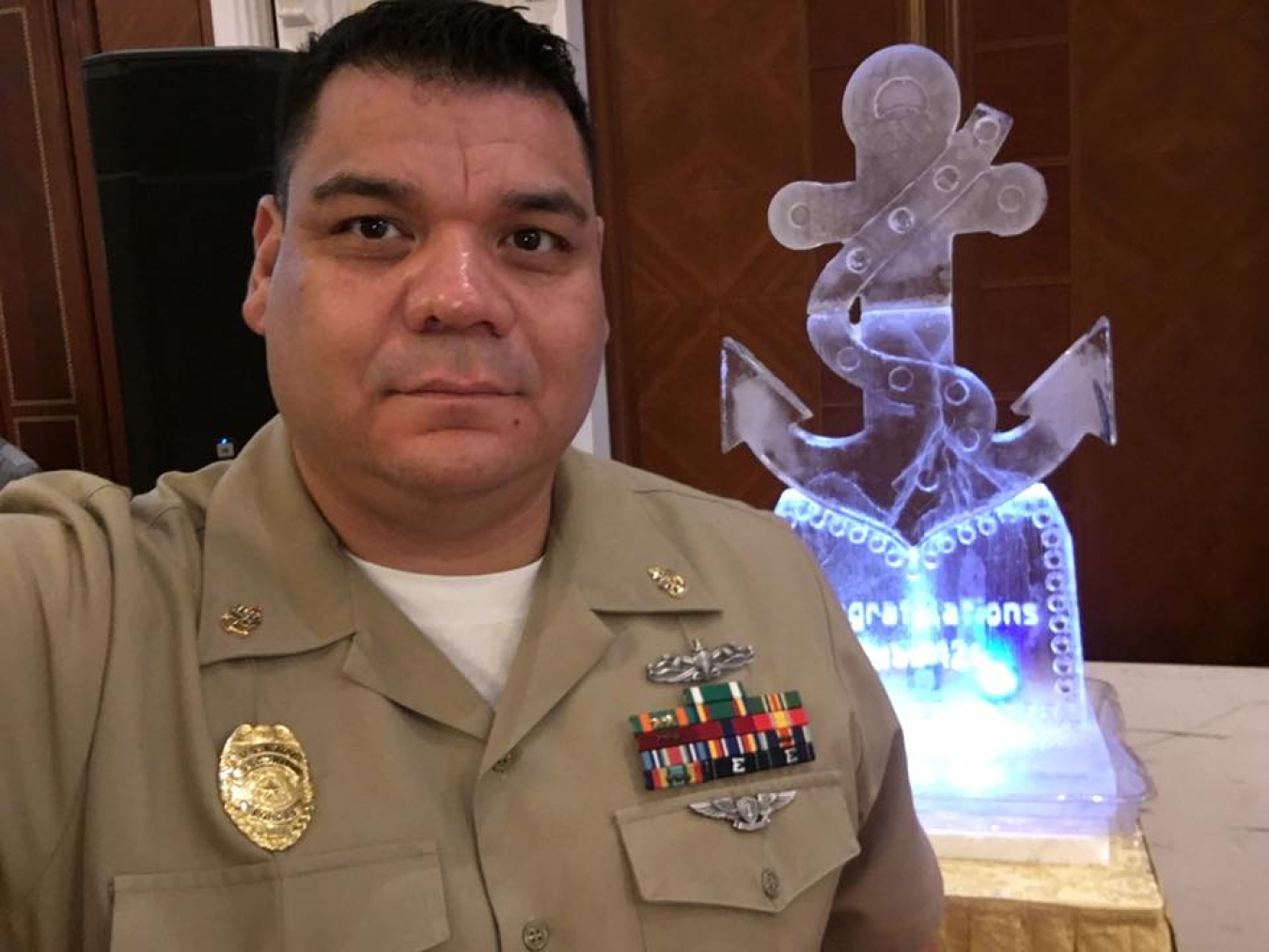 A person in a military uniform looking at the camera.