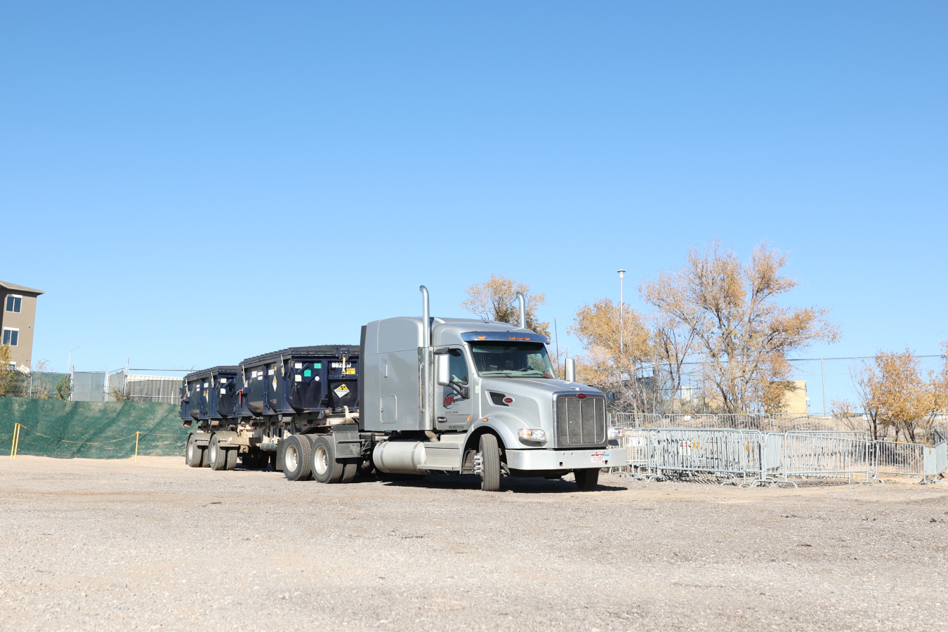 Truck loaded with containers for disposal
