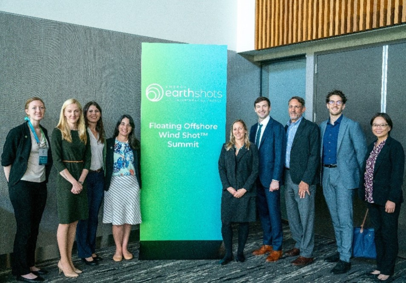 A group of people standing for a photo at a conference